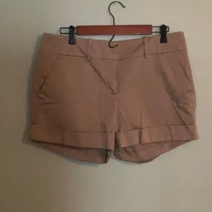 New York & Company tan shorts with front pockets, back pockets and cuffs. Sz 10.